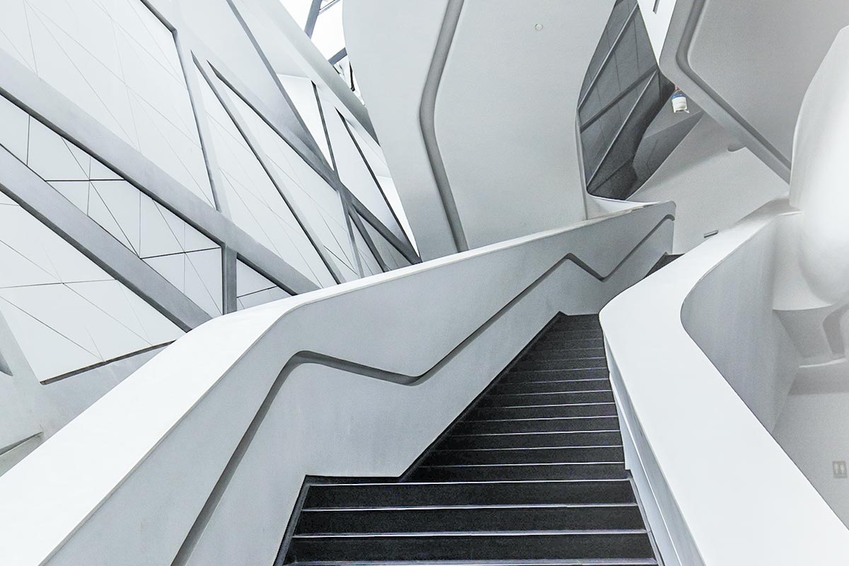 Futuristic white staircase with geometric design.