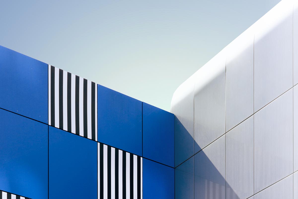 Blue and white geometric building corner.