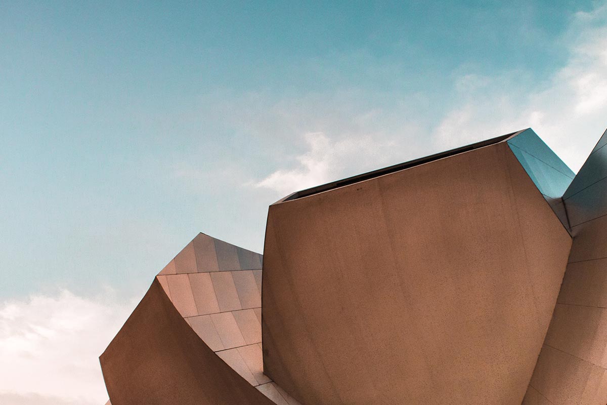 Abstract geometric metal architecture against sky